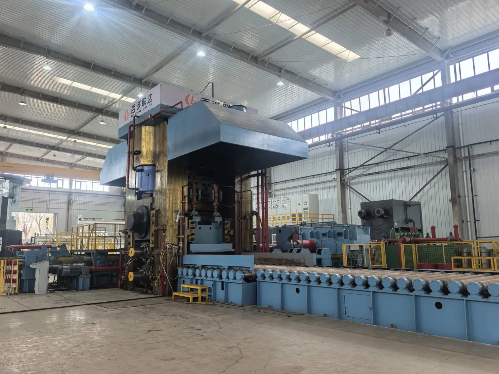 Primary processing equipment and roller table inside a workshop