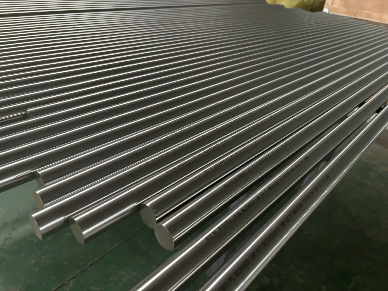 Polished round titanium bars grouped in a workshop