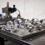 batch of finished titanium CNC precision components neatly arranged in workshop