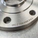 Close-up of GR2 Titanium Flange 2 inch 150# ASME B16.5 showing laser engraving and precision bolt holes - Beiyu Titanium