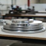 Stacked custom metal sputtering targets in manufacturing workshop