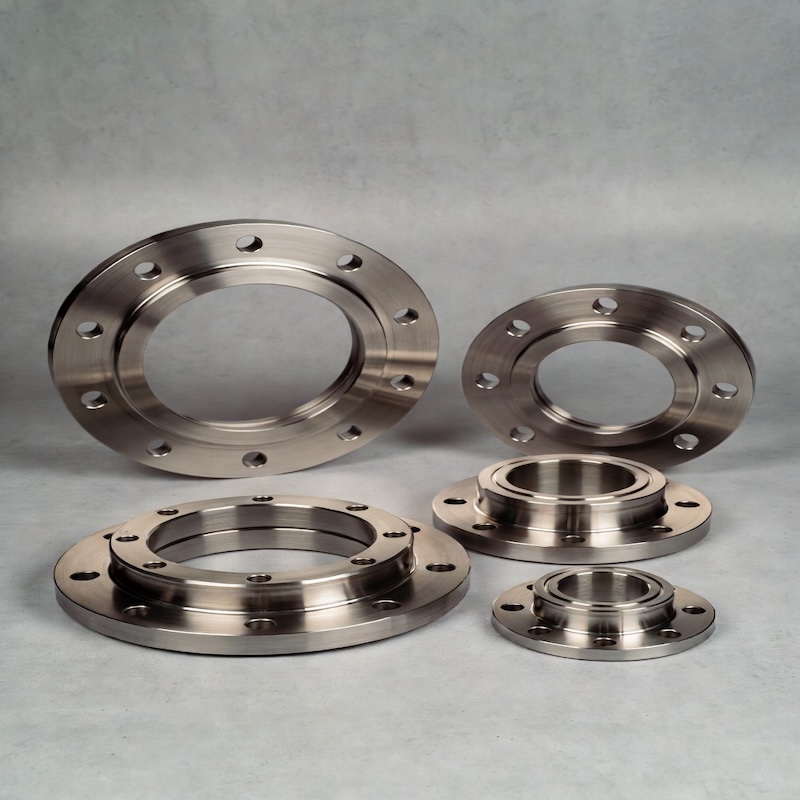 Side view of a thick forged titanium flange highlighting its robust construction and smooth machined surfaces