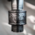Close-up detail of titanium agitator shaft surface showing high-precision machining and material texture, Grade 2/Grade 5 titanium stirring shaft