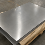 Inconel 625 alloy plates on wooden pallet with kraft paper packaging - high-strength nickel alloy for marine and offshore use