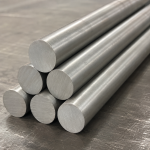Inconel 718 nickel alloy bars displayed on metal surface, highlighting excellent finish and dimensional accuracy, UNS N07718 superalloy bars