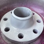 Grade 12 titanium weld neck flange during PT inspection after developer application