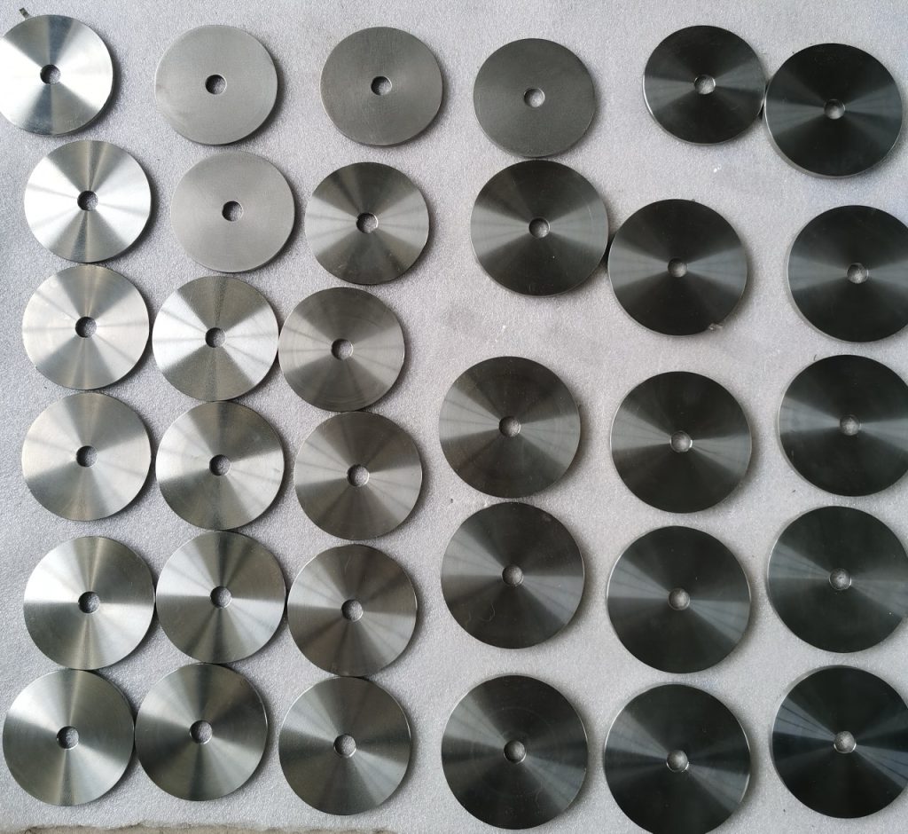 Machined Grade 5 titanium discs with center holes