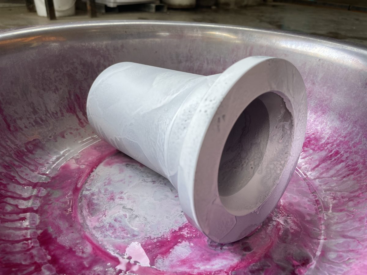 Titanium forged component during penetrant inspection after developer application
