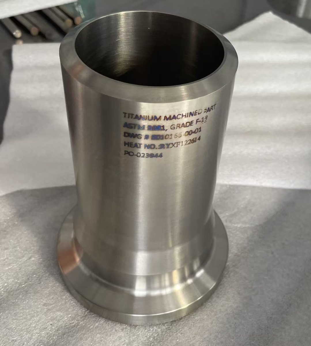 Titanium machined part marked ASTM B381 Grade 12 with drawing and heat number