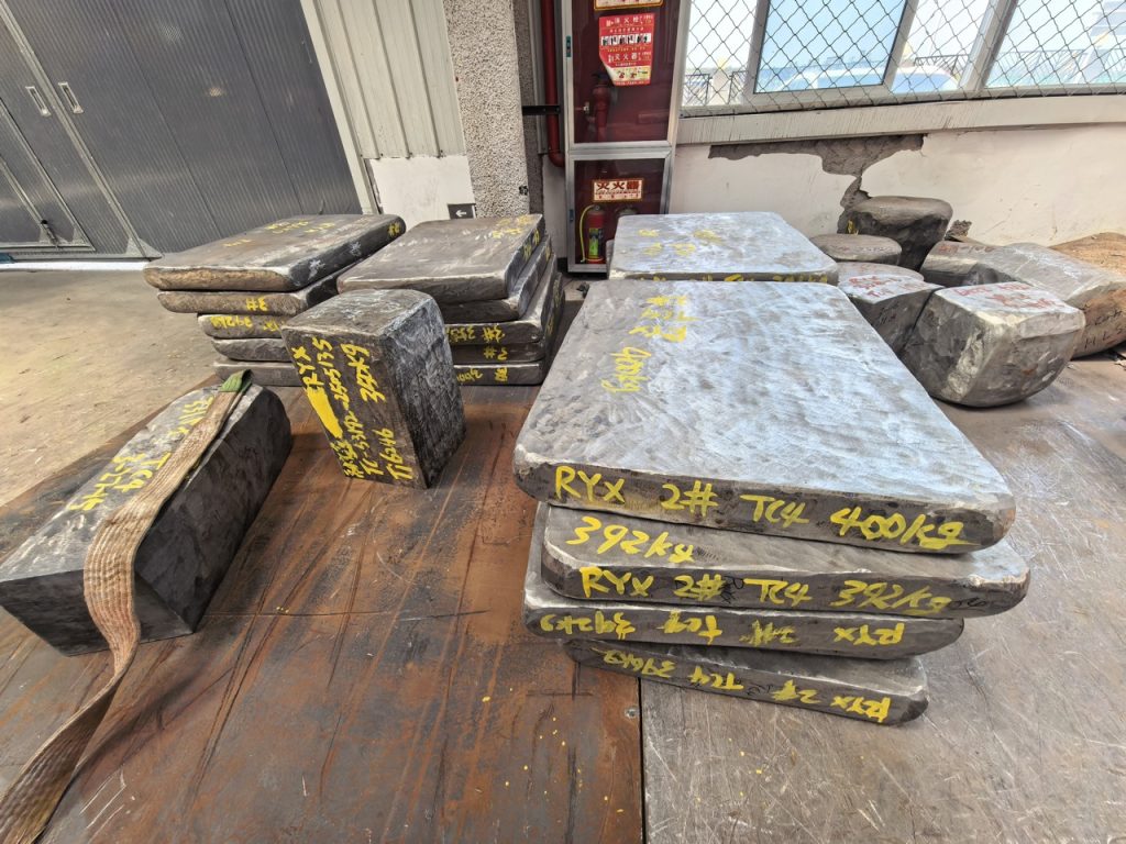 Forged TC4 titanium slabs with lot markings and heat weights