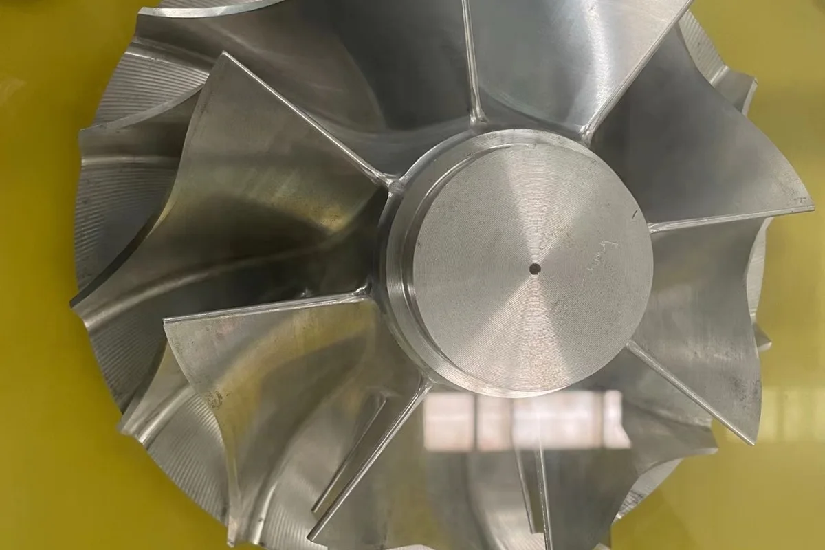 Machined titanium impeller produced from a forged blank to ASTM B381