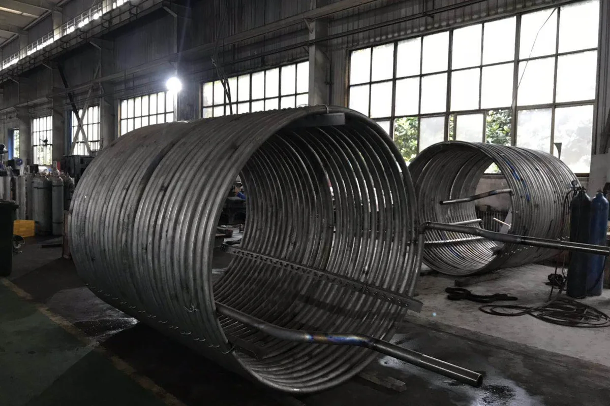 Titanium heat exchanger coils in the workshop for corrosive process service