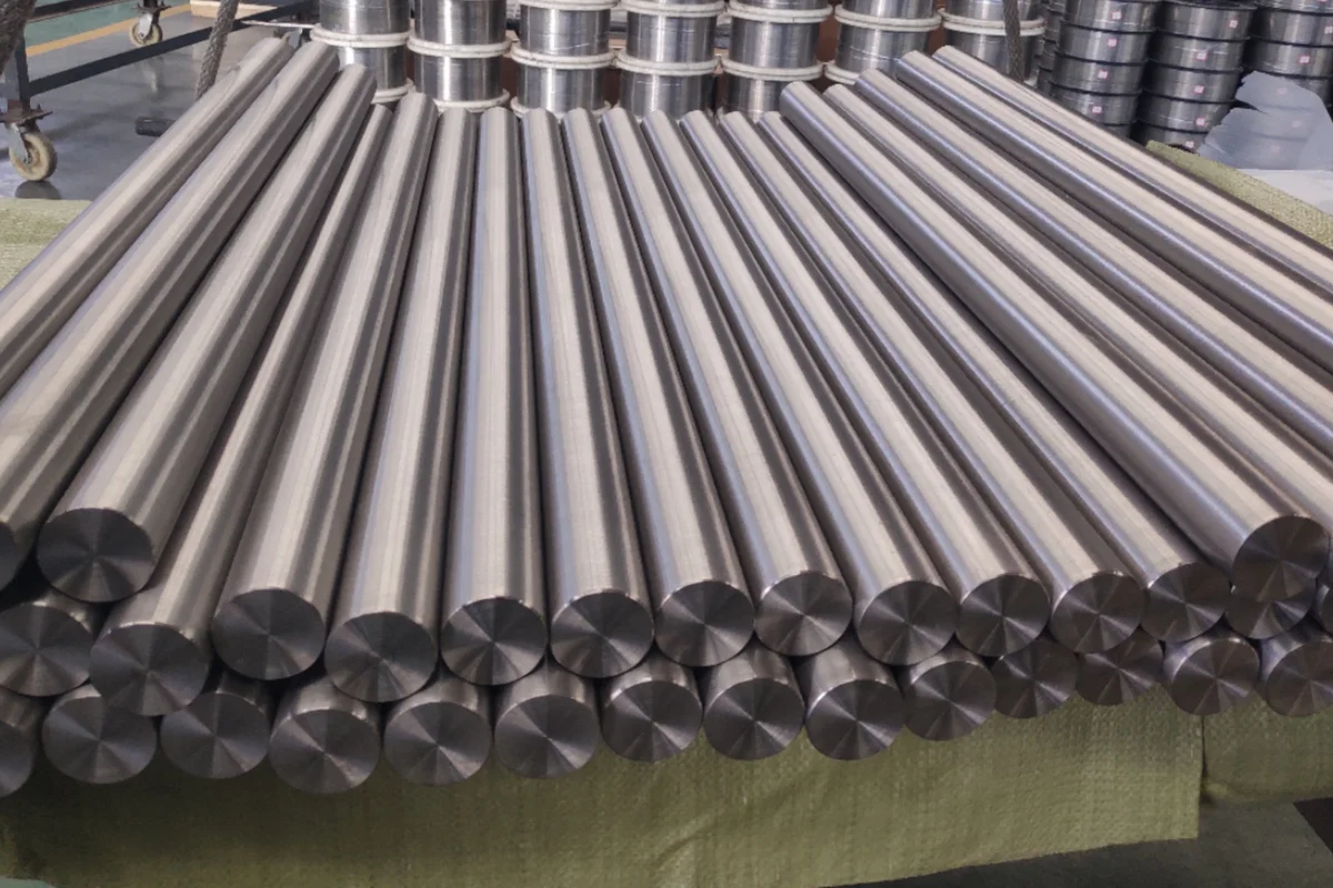 Batch of precision ground titanium round bar laid out for inspection