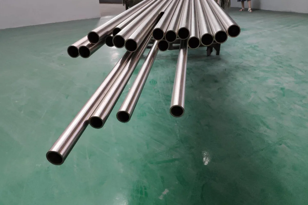 Titanium tube in several outside diameters with bores visible, supplied to ASTM B338, B861 or B862