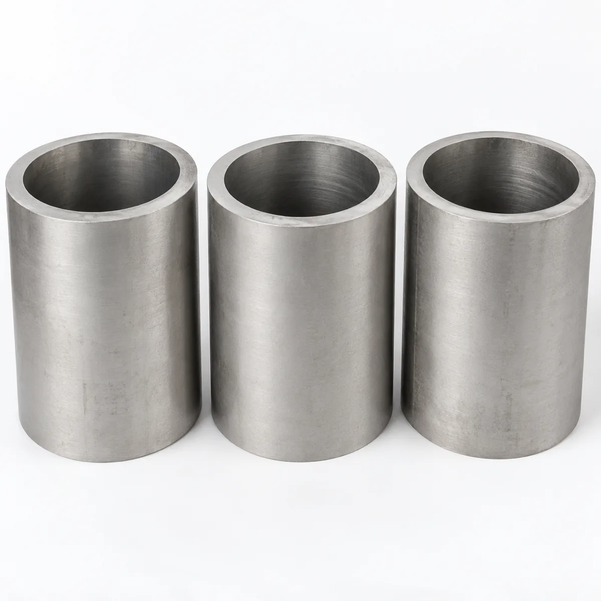 Large diameter titanium pipe sections with the bore and wall visible, illustrative studio image of the product form