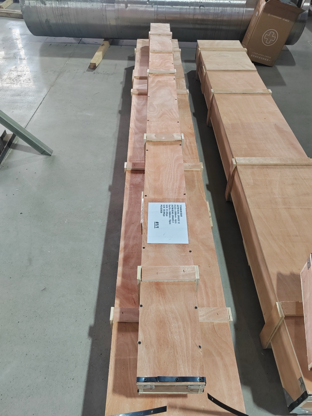 Long titanium bars film-wrapped on wooden battens