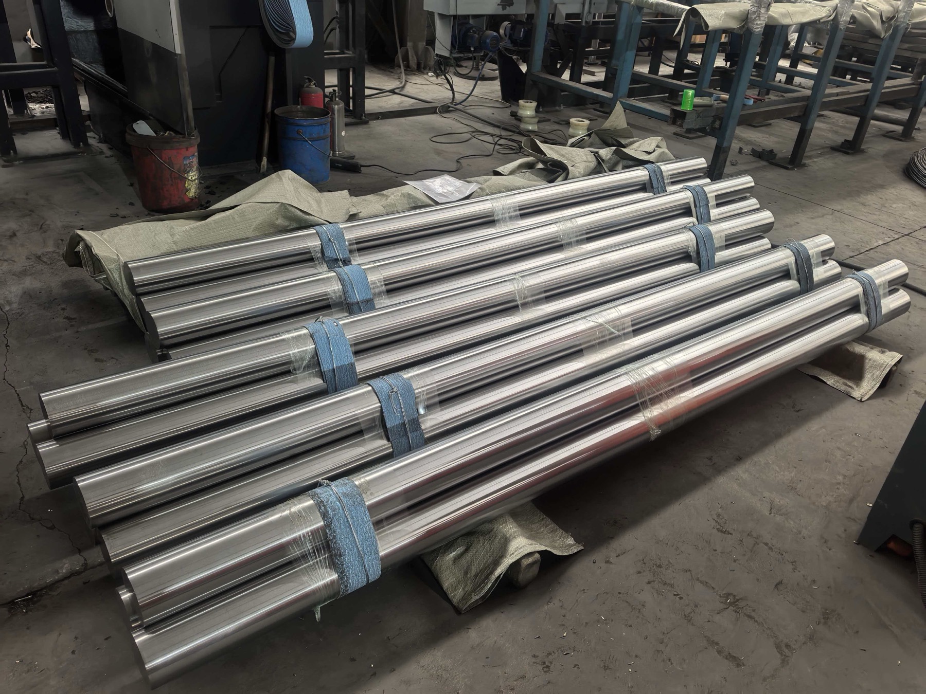Polished titanium round bars bundled in a workshop before export packing